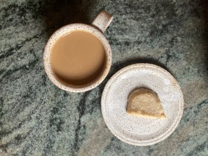 cookie on plate, cup of coffee