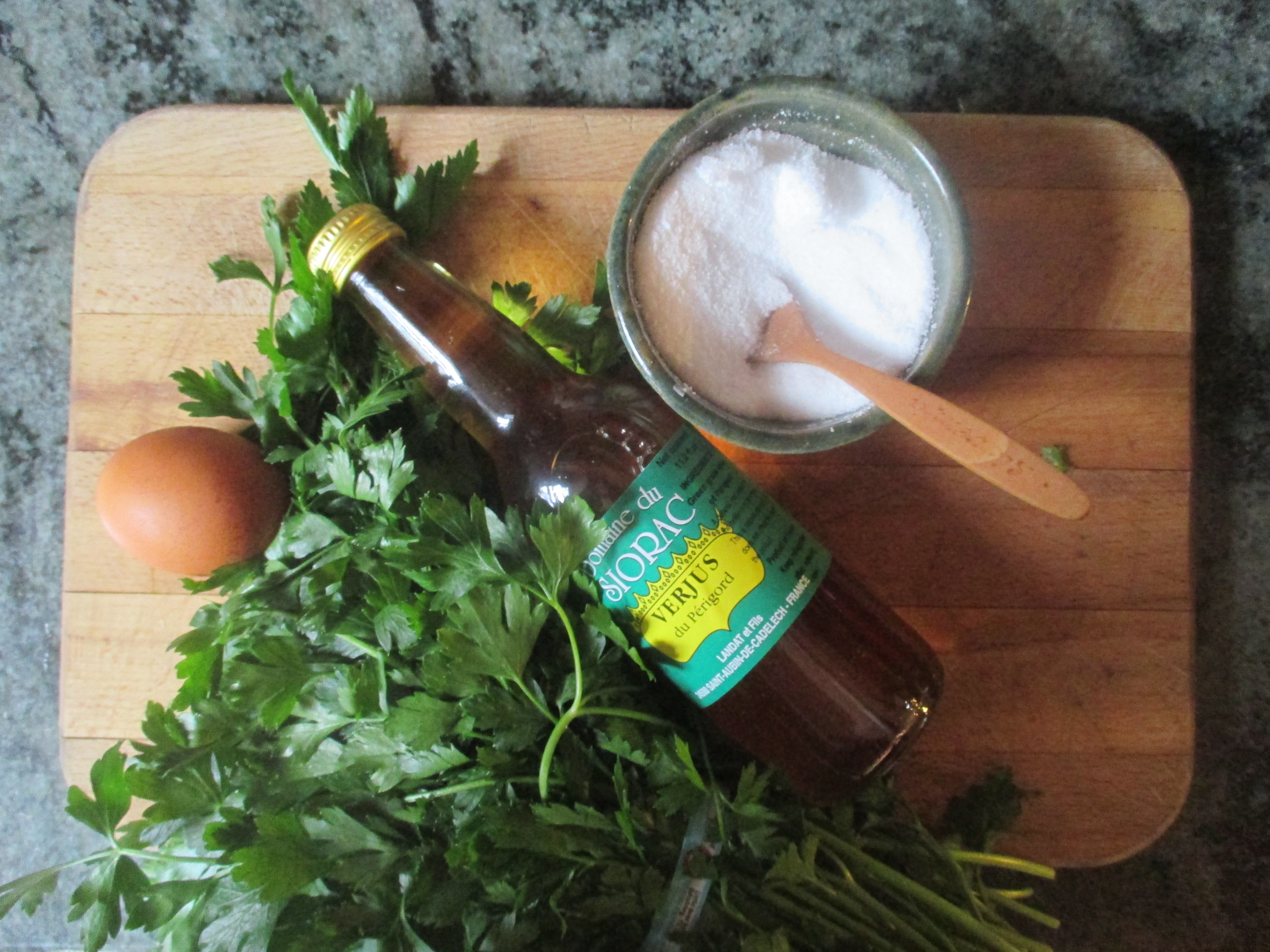 egg, parsley, verjus & salt on cutting board