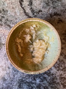 cooked, mashed garlic and sugar in bowl