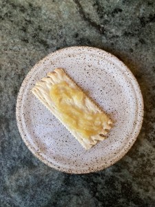 garlic mixture spread on cracker