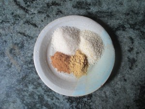 sugar, breadcrumbs, cinnamon, and ginger on a plate