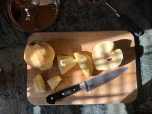 cut quince on wooden cutting board