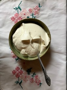cloth background, bowl with whipped cream
