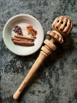 countertop with plate with spices and hot chocolate whisk
