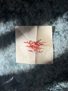 saffron strands on paper on counter