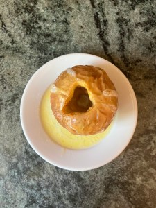 baked apple on white dish on counter